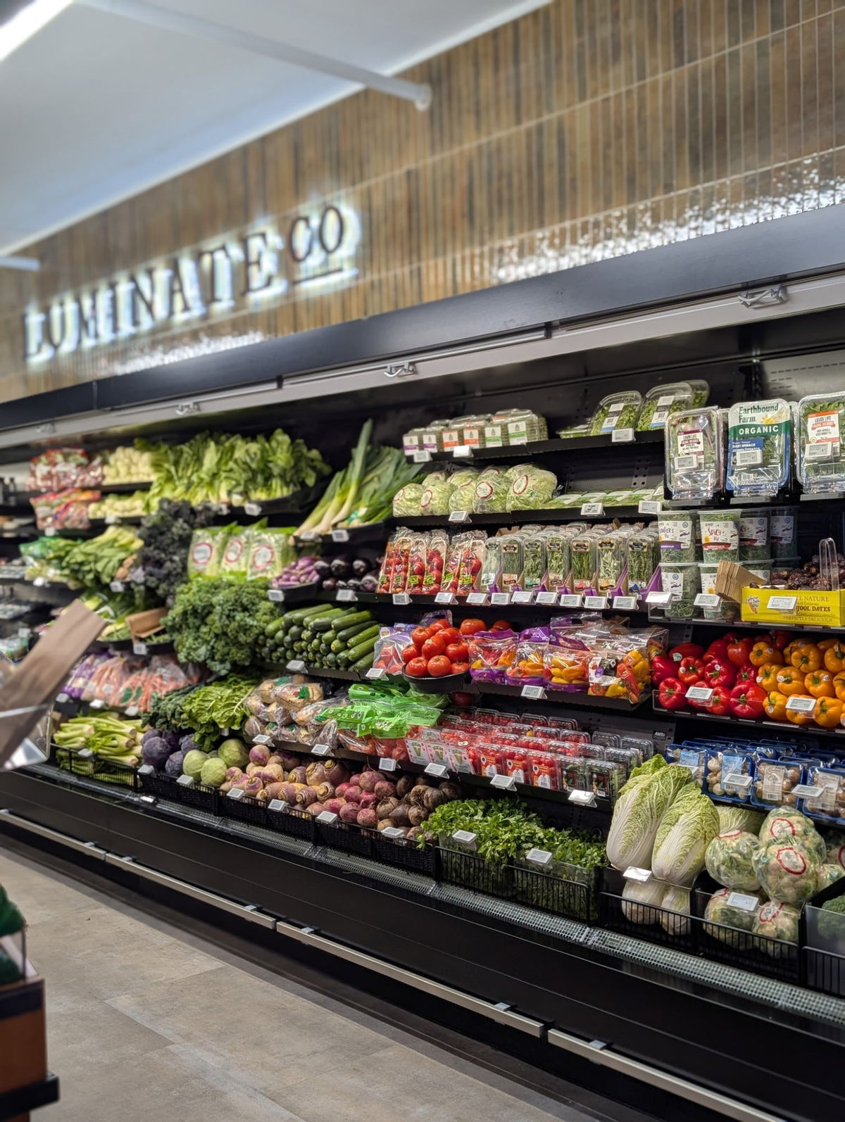 The organic produce wall at Luminate Co Wellness Market in Bedford, Nova Scotia
